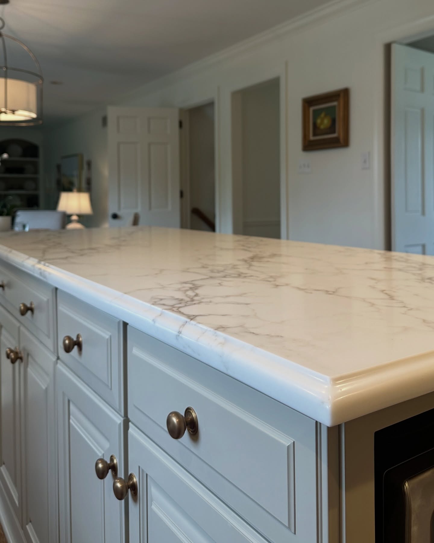 Finished kitchen with marble island by Orozco's Granite